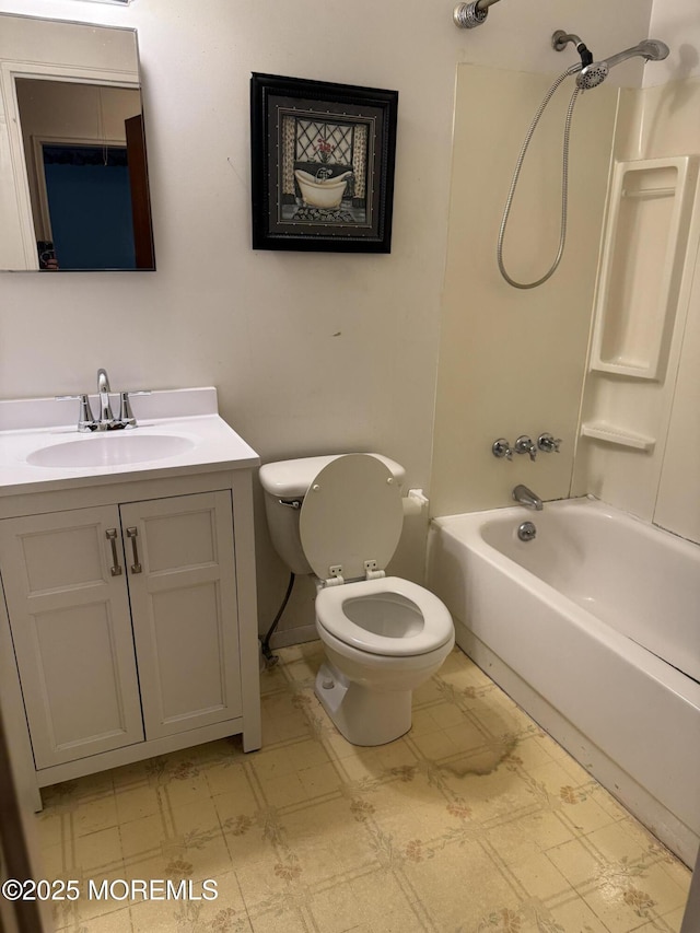 full bath featuring tile patterned floors, tub / shower combination, toilet, and vanity