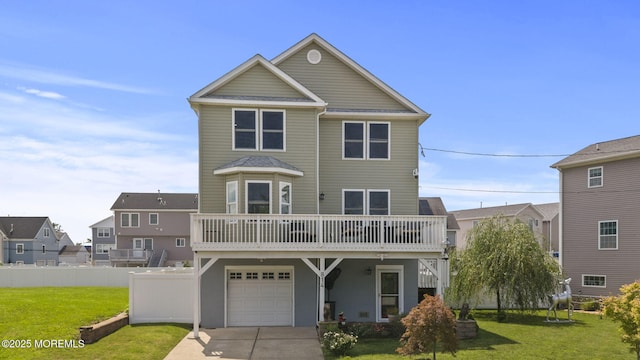 view of front of home featuring driveway, an attached garage, a front lawn, and fence