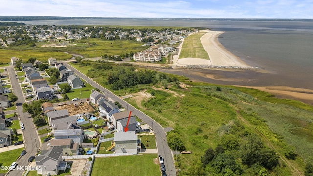 bird's eye view with a residential view and a water view