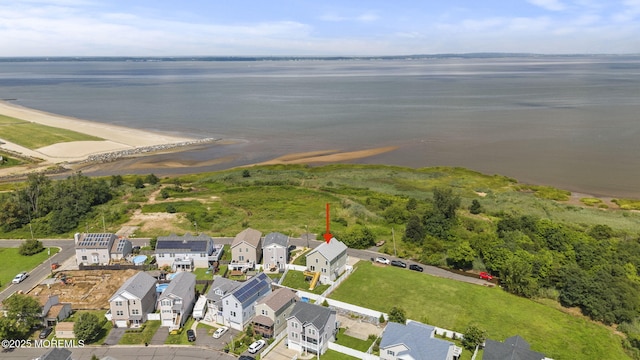 birds eye view of property featuring a residential view and a water view