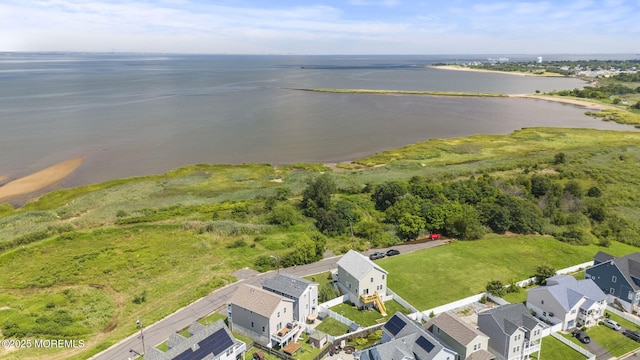 bird's eye view with a residential view and a water view