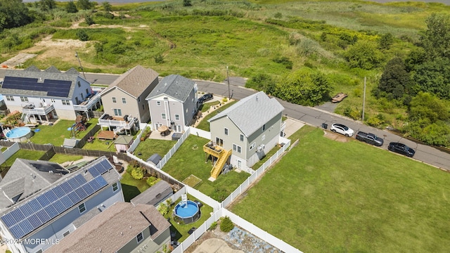 birds eye view of property with a residential view