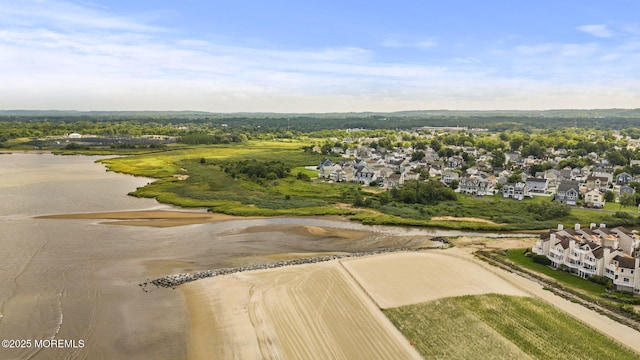 drone / aerial view with a residential view and a water view