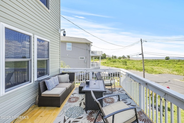 wooden deck featuring outdoor lounge area