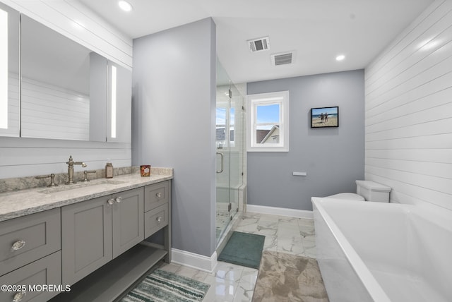 bathroom with visible vents, marble finish floor, a stall shower, and vanity