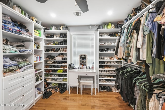 spacious closet featuring visible vents and wood finished floors