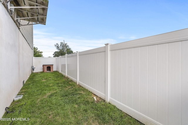 view of yard with a fenced backyard