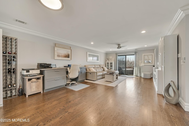 office with recessed lighting, visible vents, ornamental molding, and wood finished floors