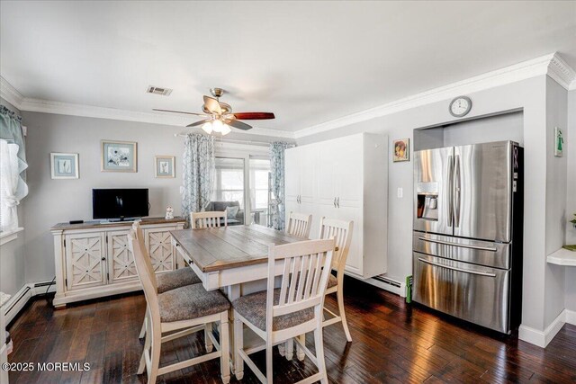 dining space with visible vents, baseboards, dark wood-type flooring, crown molding, and baseboard heating