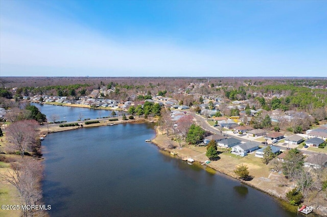 bird's eye view featuring a residential view and a water view