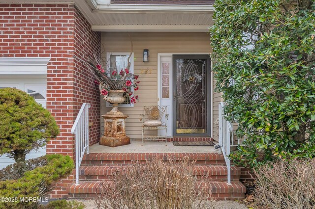 property entrance with brick siding