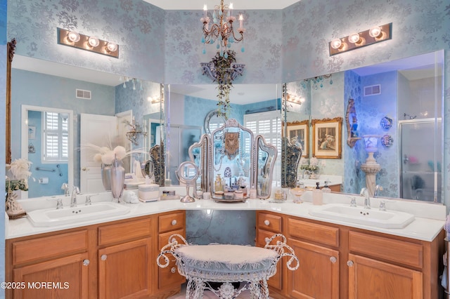 full bath with visible vents, vanity, and wallpapered walls