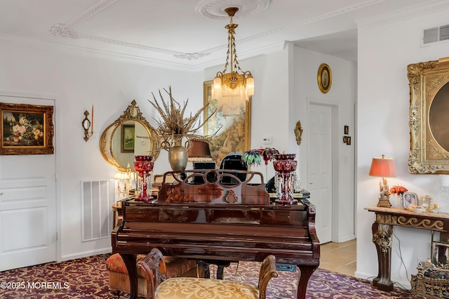 living area with an inviting chandelier, crown molding, visible vents, and tile patterned floors