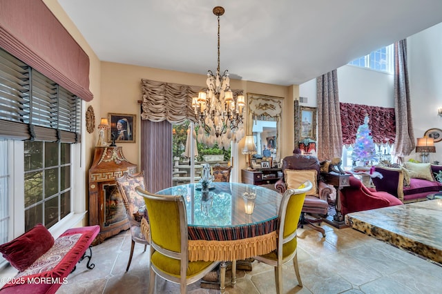 dining area with visible vents and an inviting chandelier