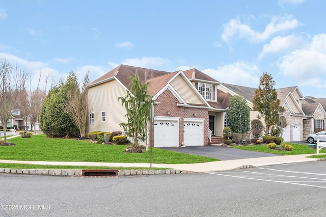 view of front of house with driveway, brick siding, a front lawn, a garage, and a residential view