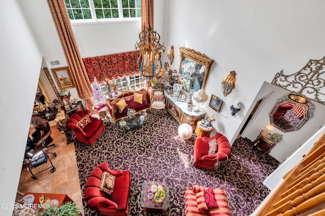 living room with a notable chandelier and visible vents