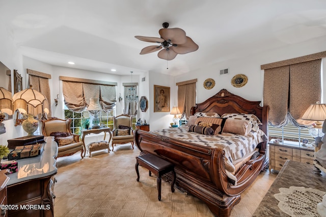 bedroom featuring a ceiling fan and visible vents