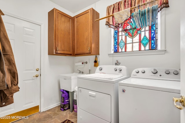 laundry area with cabinet space and washing machine and clothes dryer