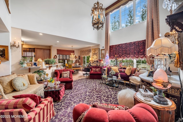 living room featuring a notable chandelier, recessed lighting, and a high ceiling