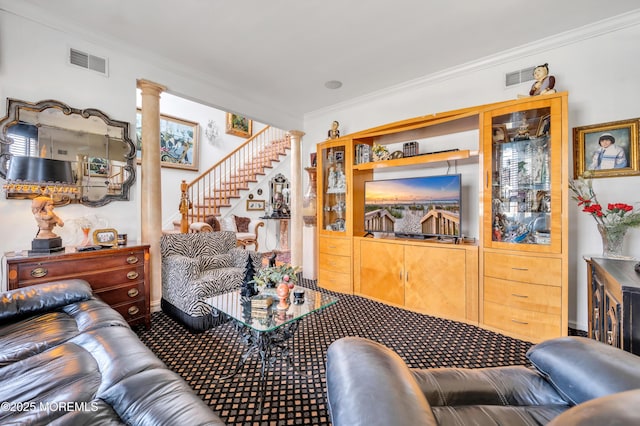 living area with visible vents, carpet, stairway, ornamental molding, and ornate columns