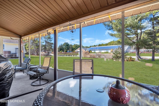 sunroom with vaulted ceiling and wooden ceiling