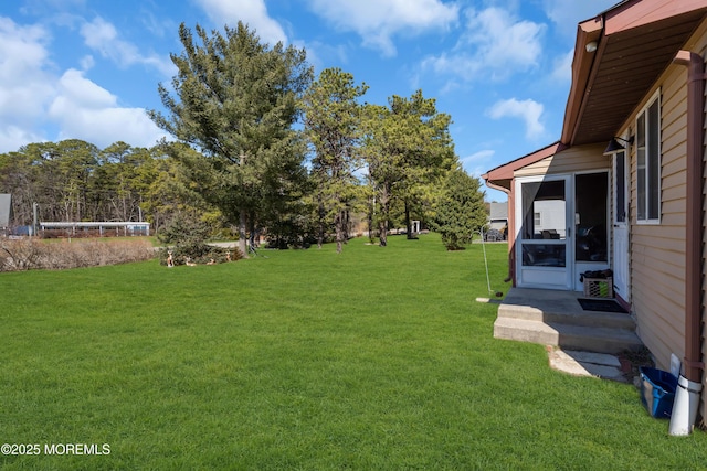 view of yard with a sunroom