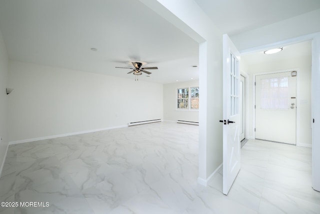 empty room featuring marble finish floor, a ceiling fan, baseboards, and a baseboard radiator