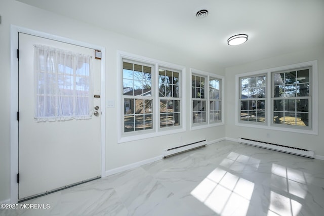 unfurnished sunroom featuring a baseboard heating unit, visible vents, and a baseboard radiator