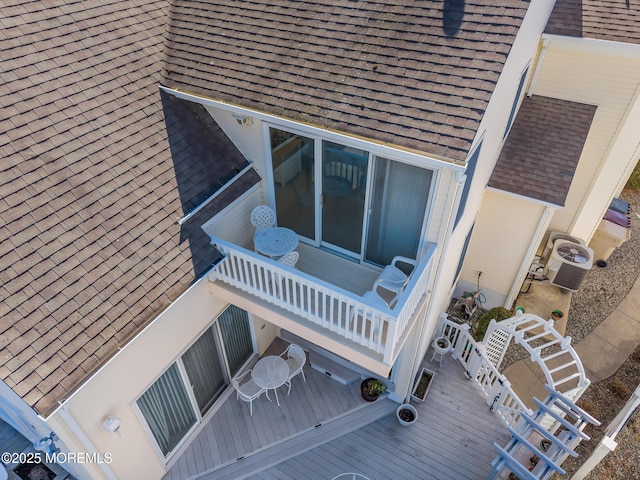 exterior details with roof with shingles