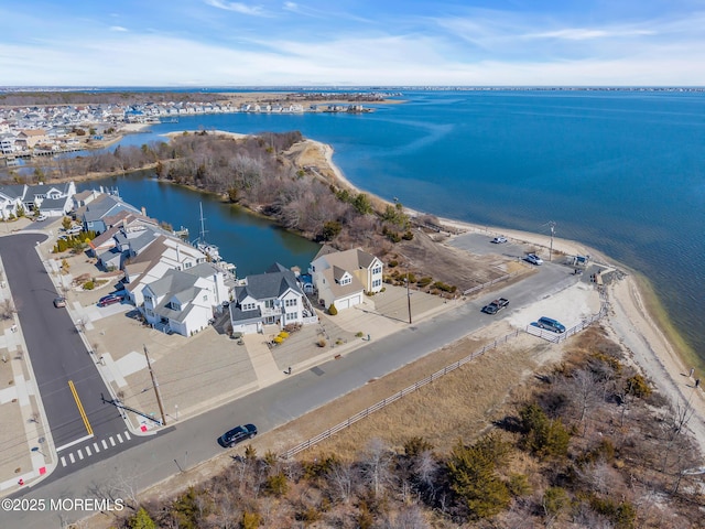 birds eye view of property with a residential view and a water view