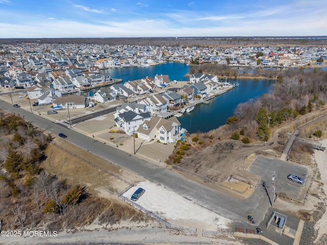 aerial view with a residential view and a water view