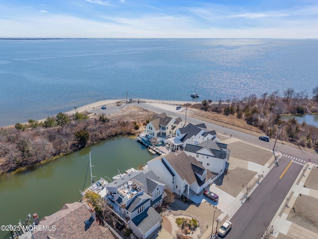 birds eye view of property with a residential view and a water view