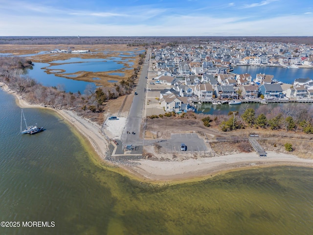 birds eye view of property with a residential view and a water view