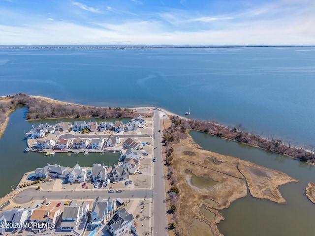 bird's eye view with a water view and a residential view