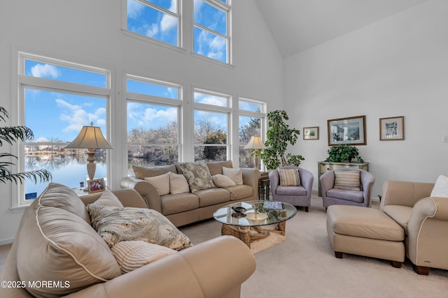 living room featuring a high ceiling and carpet flooring