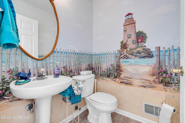 half bath featuring tile patterned flooring, visible vents, and toilet