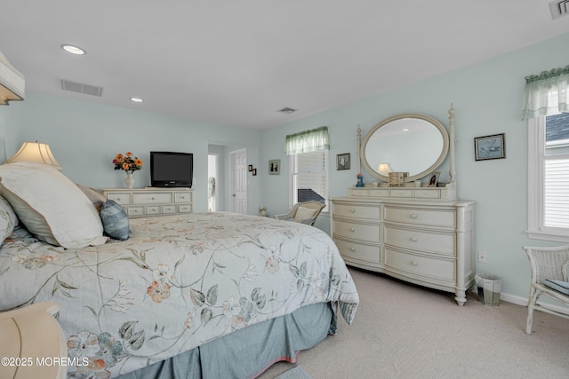 carpeted bedroom with recessed lighting, visible vents, and baseboards