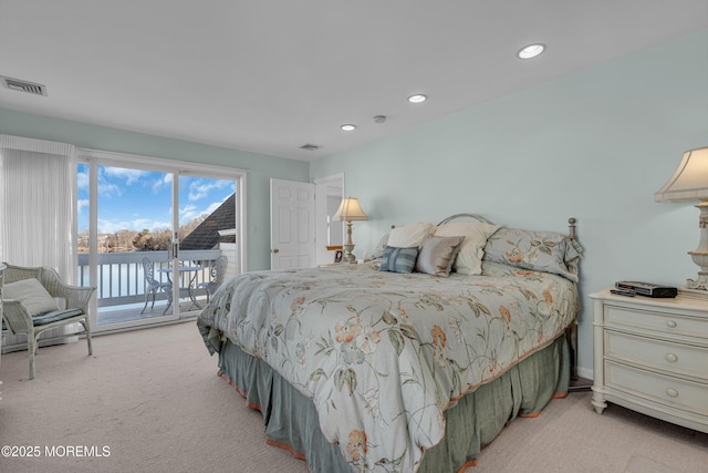 bedroom featuring recessed lighting, visible vents, light carpet, and access to outside