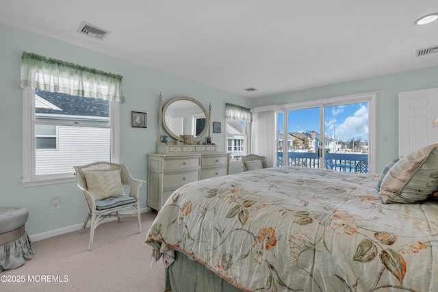 bedroom featuring visible vents, baseboards, light colored carpet, and access to exterior