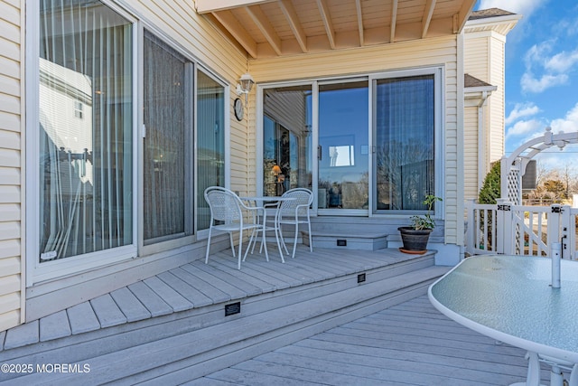 wooden deck with outdoor dining area