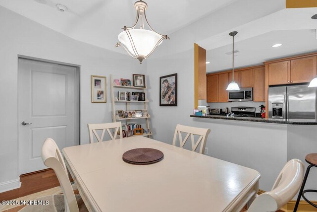 dining room featuring recessed lighting and wood finished floors