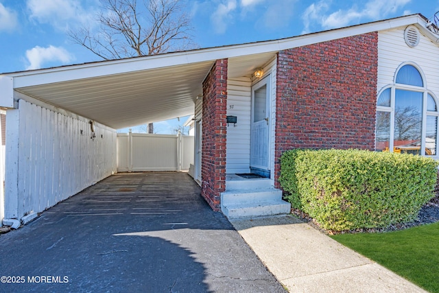 view of car parking featuring a carport and concrete driveway