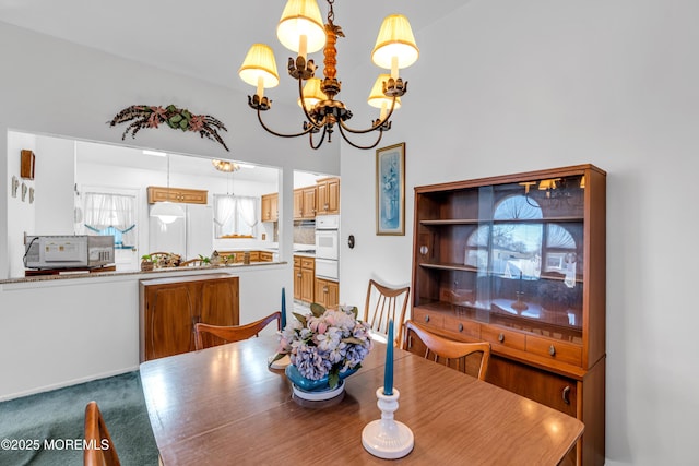 dining room featuring a notable chandelier