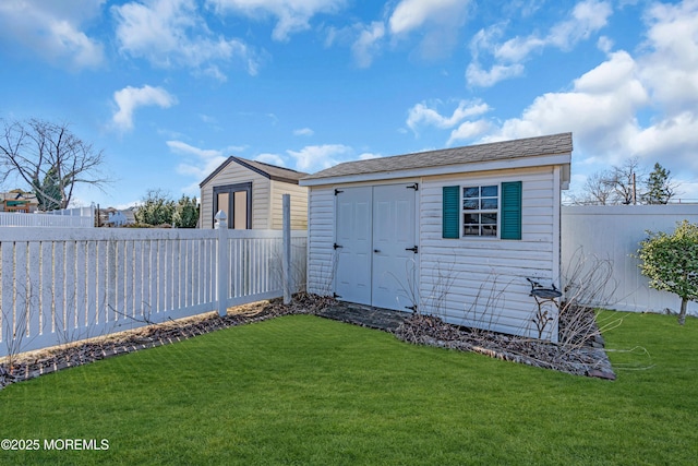 view of shed with a fenced backyard