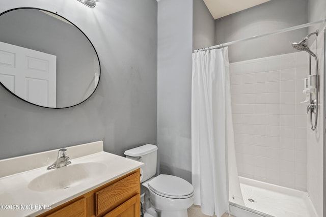 full bath featuring tile patterned floors, a shower stall, toilet, and vanity