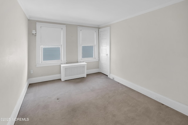 unfurnished bedroom featuring crown molding, radiator heating unit, baseboards, and carpet floors