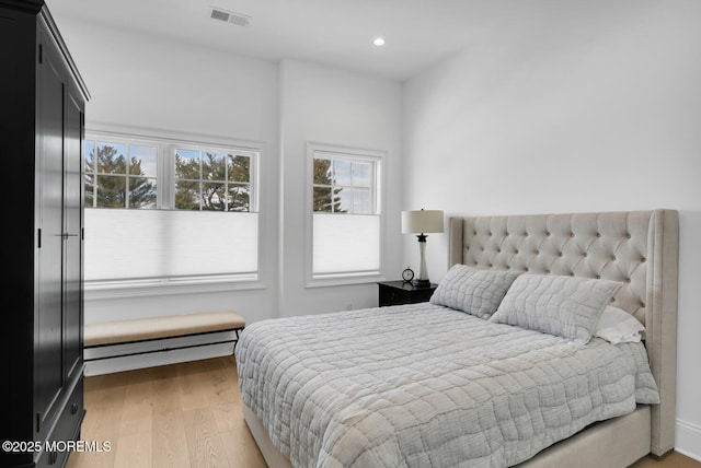 bedroom with recessed lighting, visible vents, and light wood finished floors