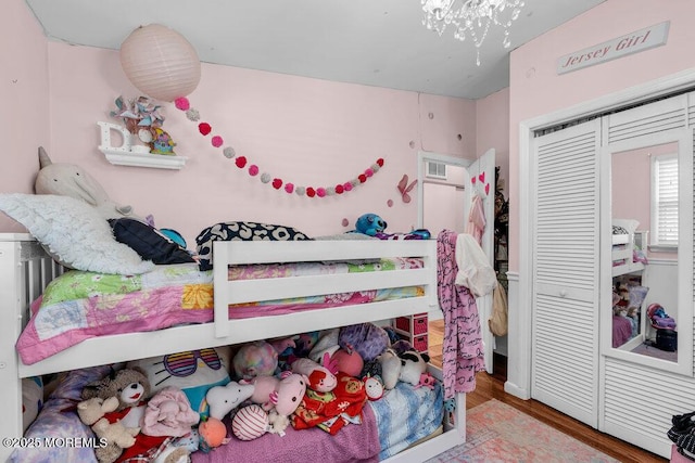 bedroom featuring a closet and wood finished floors