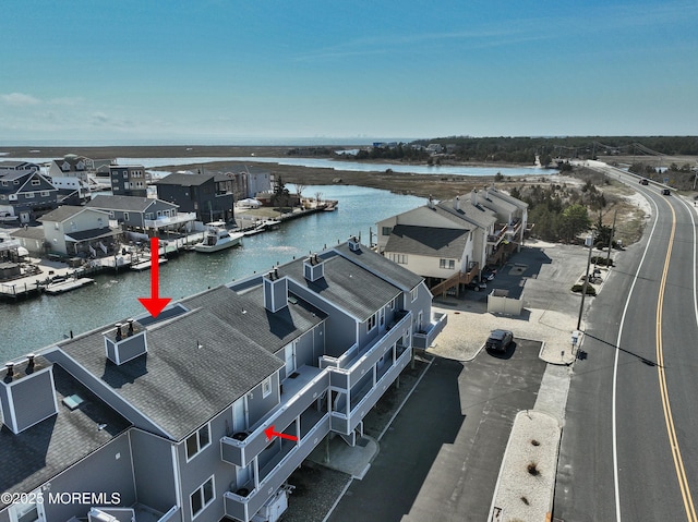 aerial view featuring a residential view and a water view