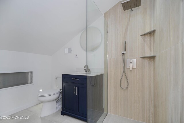 bathroom featuring vanity, lofted ceiling, toilet, and walk in shower